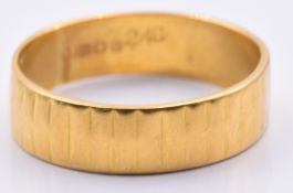 A 22ct gold textured wedding band/ ring, 4.2g, size O/P