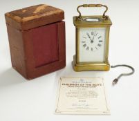 Brass corniche cased carriage clock with Roman enamelled dial, in original carry case, H10.5cm