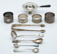 Hallmarked silver tea strainer, Georgian hallmarked silver sugar tongs with bright cut decoration,