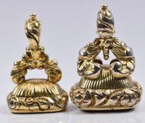 Two Victorian fobs/ seals set with carnelian agate with embossed foliate decoration