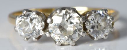 An 18ct gold ring set with three diamonds of approximately 0.6ct, 0.3ct & 0.3ct, 2.5g, size K