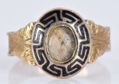 Victorian yellow metal mourning ring with black enamel decoration and hair set to the centre, 2.