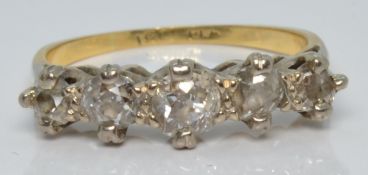 An 18ct gold ring set with five diamonds,  the largest approximately 0.2ct, 2.4g, size I