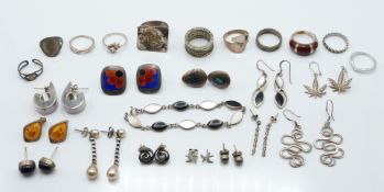 A collection of silver earrings and rings, 99g