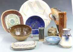 A collection of studio pottery including a large charger, vase with large improvised 'V', tray,