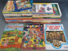 Thirty-two various children's annuals and books including Camberwick Green, Tiswas, Mission