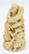 Japanese ivory carving depicting figures all completing different tasks, carved and signed to