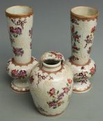 A 19thC Chinese armorial garniture of two vases (H18cm) and a ginger jar