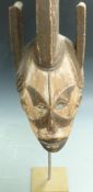 African carved wood tribal mask on stand, Ibo, Nigeria, H59cm