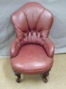 A small faux leather nursing chair and a Victorian mahogany upholstered spoonback chair