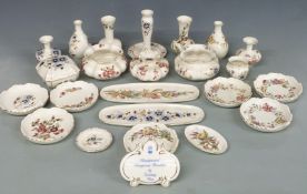 A collection of Zsolnay Pecs porcelain including trinket boxes, dishes, vases, Zsolnay advertising