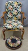 A floral upholstered mahogany armchair and footstool
