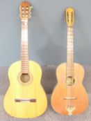 Two acoustic folk guitars, both fitted with six nylon strings, one by Marina, model GK-77, the other
