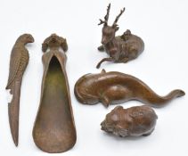 Five Japanese bronzes including a fish, parrot, elephant, deer, etc, some marked to base, largest 10