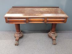 Victorian mahogany hall table with two drawers, raised on two tapering columns and four lion pad
