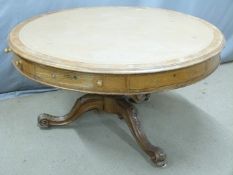 19thC oak circular leather inset oak drum or rent table raised on a scrolling tri-form base,