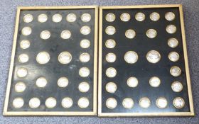 Two framed sets of twenty six Victorian pressed white metal medals and medallions with the Duke of