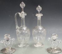 An etched glass claret jug and two matching decanters all with hollow stoppers together with a