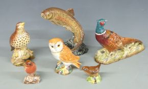 A collection of Beswick birds and fish including thrush, pheasant, trout 1032, etc, tallest 16.5cm