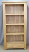 Contemporary light oak bookcase with drawer under, W99 x D36 x H191cm