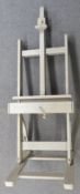 Large artist's easel with adjustable recline and screw adjustable height via handle to front and