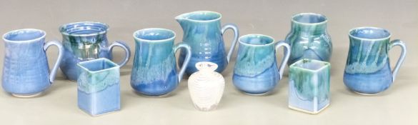 Quantity of Lamorna pottery vases, cups and a jug together with an iridescent glass vase