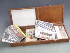 Over 100 Great Britain presentation packs, high redeemable value, in two wooden boxes