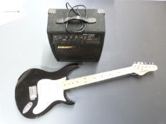 Behringer electric lead/rhythm guitar in black lacquered finish with contrasting white finger board,