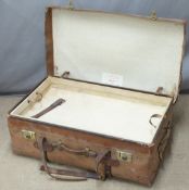 A vintage leather steamer trunk with lift out tray by H J Cave and Son, sole makers of the 