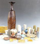 A collection of studio pottery including some impressed GMB, tiles, large vase, Wootton Courtenay