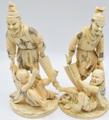 A pair of Japanese Meiji period ivory okimonos of a man with parasol holding a struggling