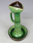 Christopher Dresser style pottery chamberstick with green glaze, possibly Linthorpe, H24cm