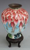 A late 19th/20thC Japanese Ginbari silver vase on stand decorated with red tendrils on a pale blue