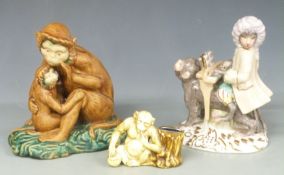 Three various monkey figures, tallest 28cm
