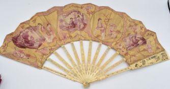 A 19thC Chinese carved ivory fan with pierced guard sticks and watteau scenes, in J Duvellory box