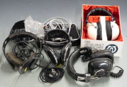 A collection of vintage headphones including Ross RE-270, Micro Diamond SK8005, Revox RH31, boxed