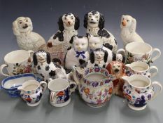 A collection of Staffordshire dogs, Gaudy Welsh and ironstone jugs, tygs etc, tallest 25cm