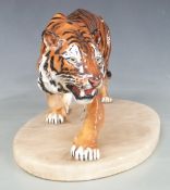 Royal Doulton Stalking Tiger HN 2646 mounted on an oval alabaster base, H14, L35cm