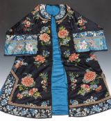 A 19thC Chinese coat with embroidered decoration and original label to the inside.