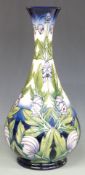 Moorcroft Prestige pedestal vase decorated in the Wolfsbane pattern, designed and signed by Angie