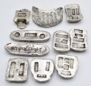 Ten Chinese silver coloured metal trade tokens/ ingots