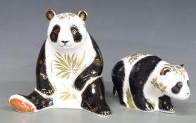 Two Royal Crown Derby paperweights, Giant Panda and Baby Panda Walking, both boxed, tallest 13.5cm