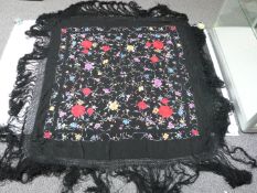 19th/20thC Chinese black shawl with embroidered chrysanthemum decoration and fringe border,