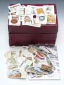 Cigarette cards in three albums together with a box of loose cards including Wills speed, Brook Bond