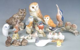 A collection of bird and animal figures including Copenhagen kingfisher and gull, two Beswick