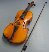 Unlabelled 20thC violin with two piece 35.5cm back, in hand carrying case with 1930s music