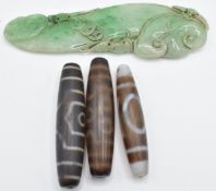 Three Tibetan beads (6cm) and a hardstone carving of bats, 10 x 3cm