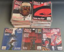 One-hundred-and-four Judge Dredd comic books/ magazines comprising 12 series 1, 45 series 2, 27
