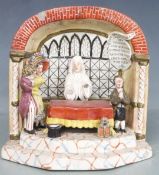 A 19thC Staffordshire figural group The Marriage Act with integral script 