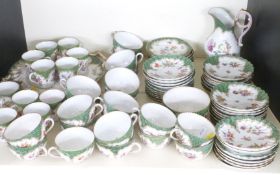 A quantity of Dresden porcelain tea and coffee ware with wrythen moulded, floral decoration and